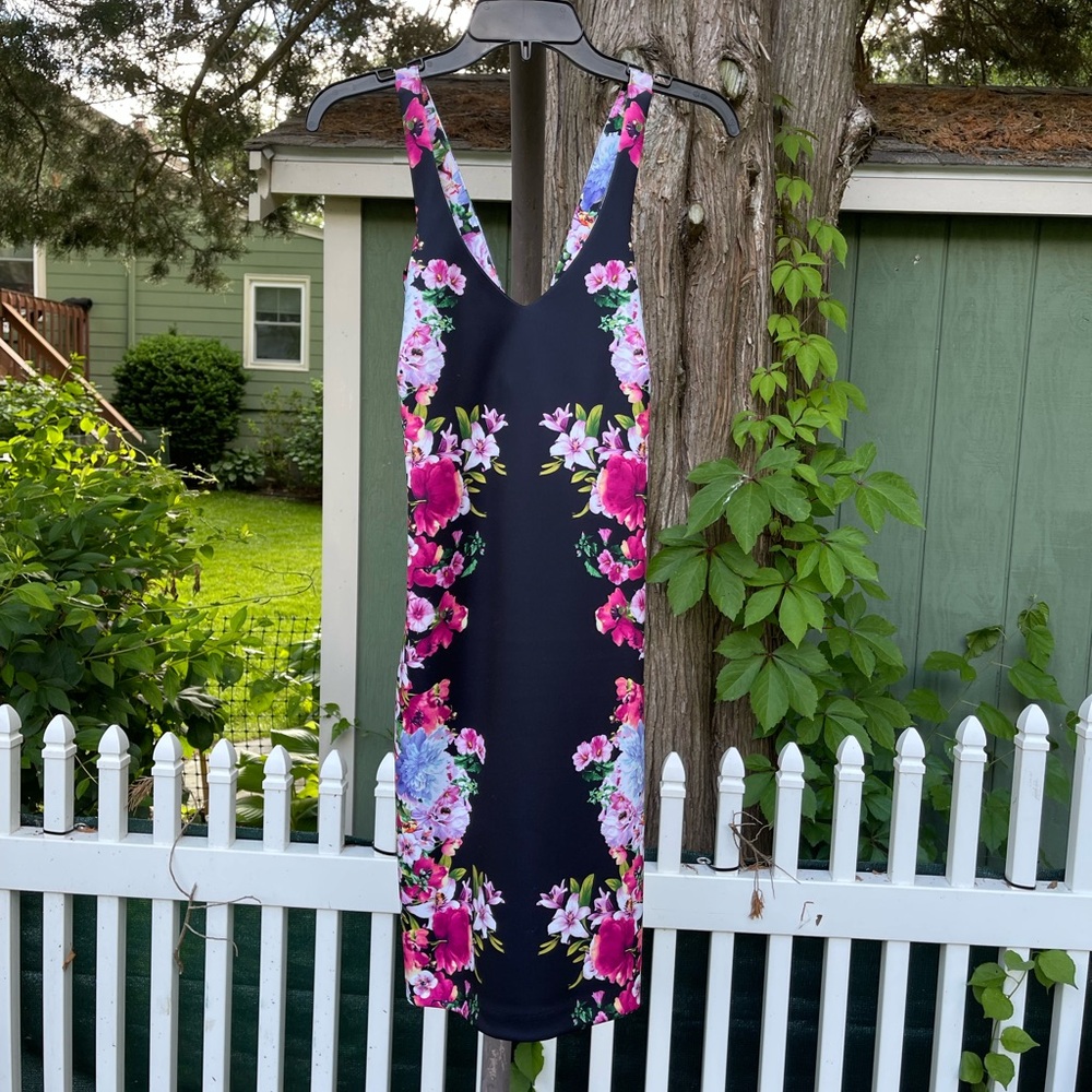 Guess size 6 new with tags. Never worn. Zip back.